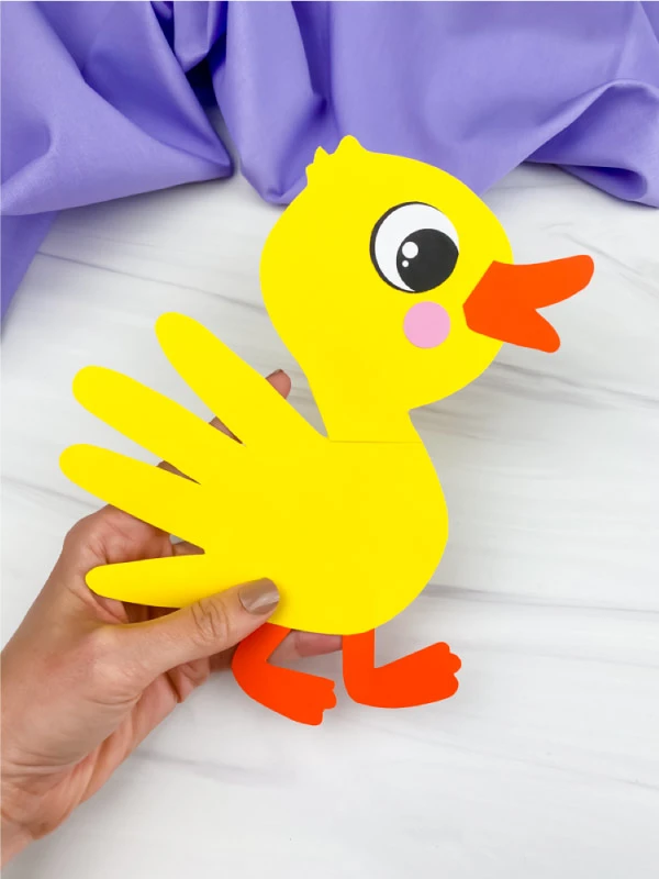 21 Easy Spring Crafts For Kids 24 Handprint Duckling craft image.jpg